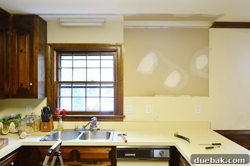 How to Remove and Rehang Kitchen Cabinets 7 Kitchen after first upper cabinet removal, view of the window area