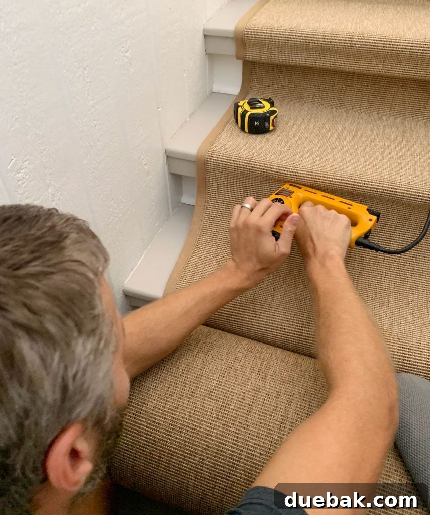 John Stapling Sisal Runner Under Lip of Stair Tread with electric staple gun