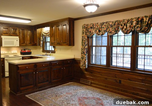 Renovated kitchen showing the bright white paneling and a refreshed view