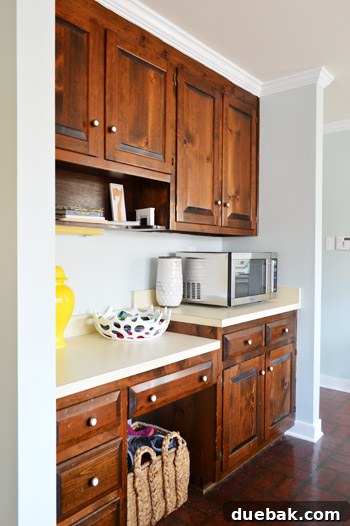 Serene Blue-Gray for Kitchen Walls 6 Compact stainless steel countertop microwave, a budget-friendly replacement destined for the pantry, ready for a seamless kitchen integration.