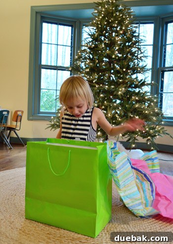 Clara unwrapping a gift, eager to discover its contents