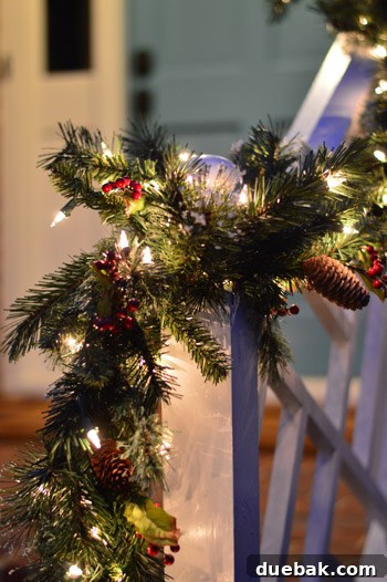 Effortless Window Wreath Styling 14 A close-up view of several strands of lighted Christmas garland, highlighting their convenient design allowing them to plug into each other for extended, seamless decoration.