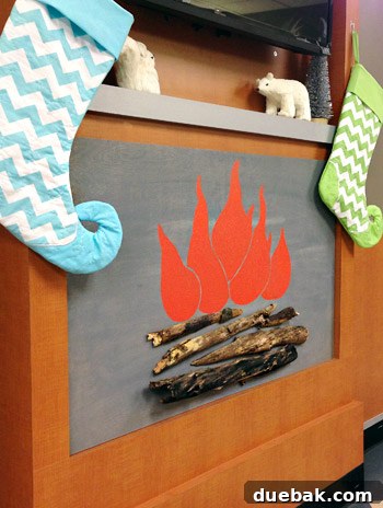 Get Crafting 4 DIY Holiday Decorations 10 Finished faux fireplace with holiday decorations and stockings on mantle for Childrens Hospital of Richmond waiting room
