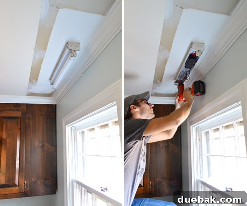 Upgrade Your Lighting: Swapping Fluorescent Fixtures for Pendants 12 Fluorescent light fixture above kitchen sink getting uninstalled