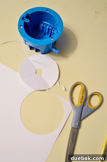 Upgrade Your Lighting: Swapping Fluorescent Fixtures for Pendants 15 Cutting paper template for old work electrical fixture box