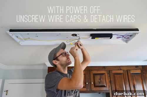 Upgrade Your Lighting: Swapping Fluorescent Fixtures for Pendants 5 John disconnecting wires in fluorescent light in kitchen