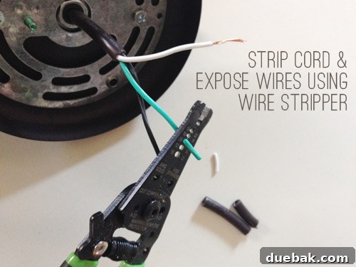 Upgrade Your Lighting: Swapping Fluorescent Fixtures for Pendants 9 Stripping cord and wires of pendant light fixture with wire stripper tool