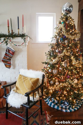 After photo of the lounge area, featuring a whimsical tree and a styled mantel.