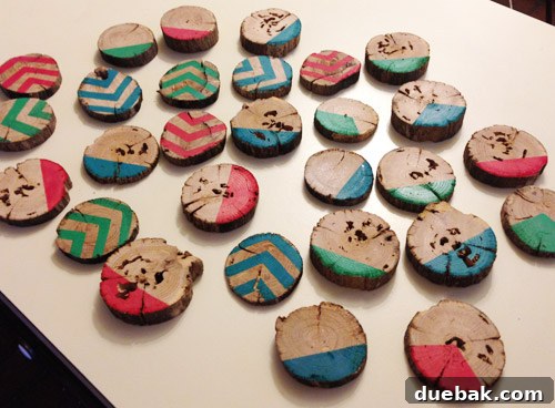 Rustic Wood Slice Christmas Creations 11 Newly painted wood slice ornaments laid out to dry