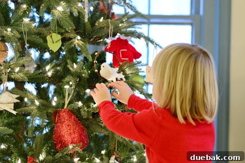 Rustic Wood Slice Christmas Creations 5 Child admiring a beautifully decorated Christmas tree