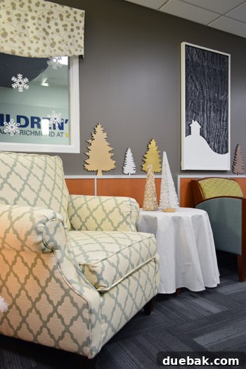 Brightening Little Lives: Our Holiday Hospital Makeover 8 Comfy Armchair With Holiday Christmas Tree Decorations at Childrens Hospital of Richmond At VCU, showcasing a blend of comfort and festive cheer.