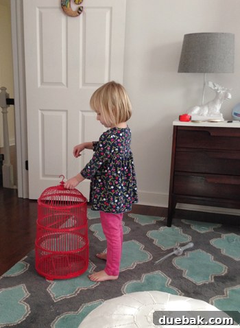 Creating Her Dream Big Girl Room Beyond the Crib 9 Clara playing with the birdcages on the floor