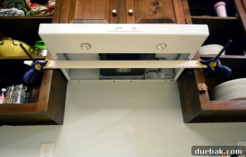 Replacing an Over-the-Range Microwave with a Range Hood 10 A range hood partially installed, demonstrating how it rests without additional back wall support