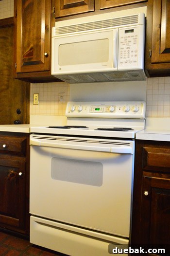 Replacing an Over-the-Range Microwave with a Range Hood 16 Before shot of the kitchen with the old over-the-range microwave