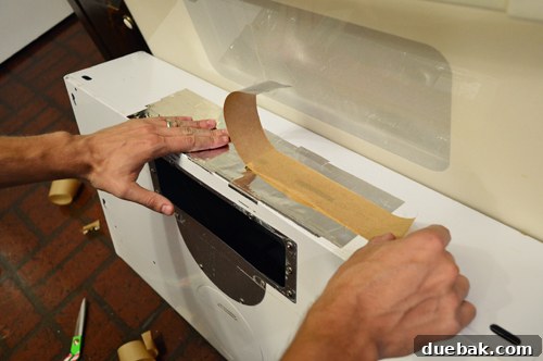 Replacing an Over-the-Range Microwave with a Range Hood 5 Close-up of a range hood showing the sealed back vent opening with silver duct tape
