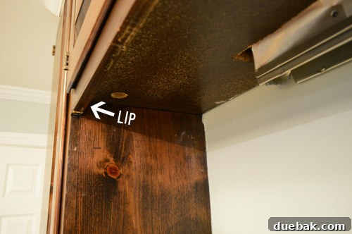 Replacing an Over-the-Range Microwave with a Range Hood 7 View of a cabinet underside, highlighting a protruding lip that obstructs direct hood mounting