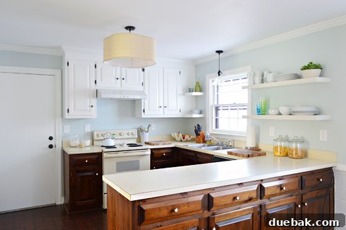Effortlessly Transform Your Kitchen with White Upper Cabinets 2 Freshly painted white upper kitchen cabinets, showcasing a bright and clean aesthetic.