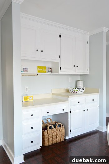 Effortlessly Transform Your Kitchen with White Upper Cabinets 14 Completed upper kitchen cabinets painted in Benjamin Moore Simply White.