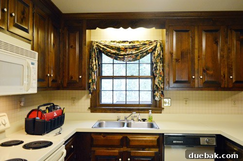 Effortlessly Transform Your Kitchen with White Upper Cabinets 19 Before shot of the kitchen sink area on inspection day.