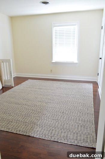 The new wool rug laid out in the nursery, starting to define the space and add warmth