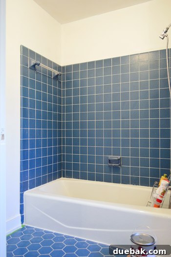Our Bathroom's Wallpaper Detox 2 Bathroom walls after wallpaper removal, now primed white, showing significant improvement.