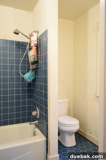 Our Bathroom's Wallpaper Detox 7 Bathroom walls completely free of wallpaper, but showing rough patches and damage.
