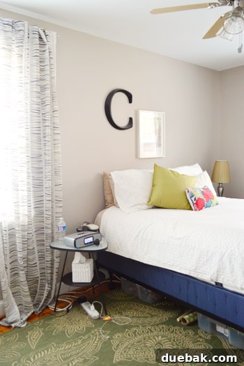 Carrie's bedroom before the makeover, showing existing furniture and decor