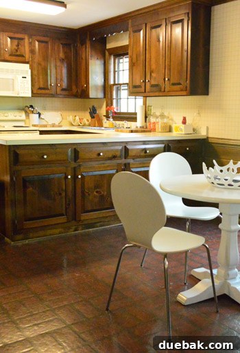 Kitchen's Gilded Past 12 Before image of the kitchen dining area, showing the previous setup before vintage wire chairs were introduced.