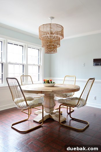 Kitchen's Gilded Past 7 Newly acquired vintage wire chairs in a kitchen setting, showcasing their vertical lines and harmonious fit with a rope chandelier.