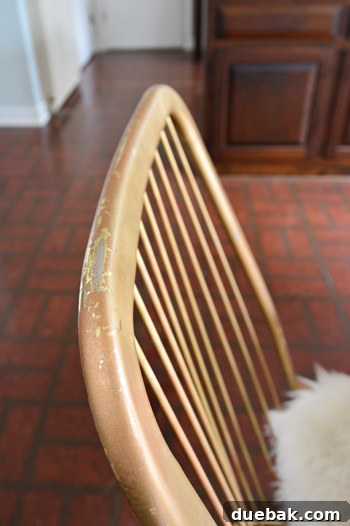 Kitchen's Gilded Past 8 A vintage wire chair in gold finish, shown in a kitchen, prompting discussion about potential color changes for a cohesive design.