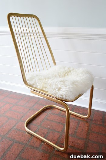 Kitchen's Gilded Past 9 Vintage wire chair featuring a temporary, cozy faux sheepskin cushion, highlighting comfort and practicality.