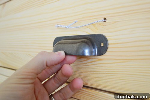 Temporary string handles on painted dresser