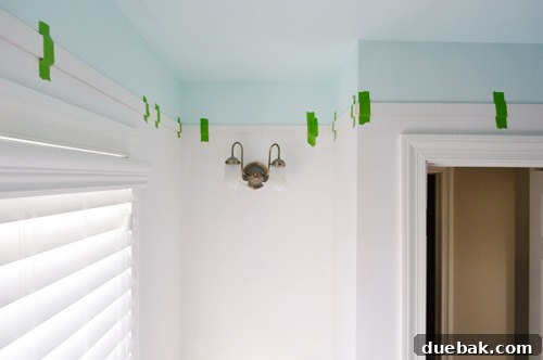 Bathroom Ceiling Transformation with Paint and Trimwork 6 Freshly painted blue ceiling and wall border in the bathroom before trim installation.