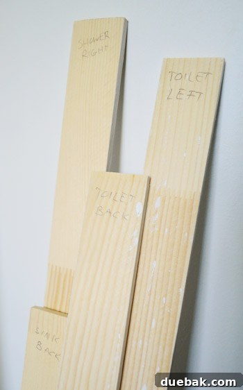 Bathroom Ceiling Transformation with Paint and Trimwork 7 Lattice trim pieces labeled and ready for painting before installation in the bathroom.
