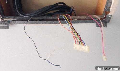 Artful Appetites 9 Capped and taped intercom wires inside the wall opening, prepared for temporary covering.
