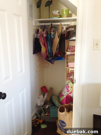Before shot of a messy craft closet in a guest room