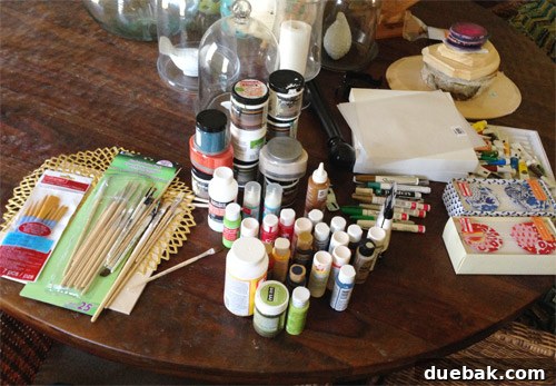 Craft supplies overflowing onto the dining table