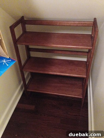Adding a folding shelf to the closet alcove for vertical storage