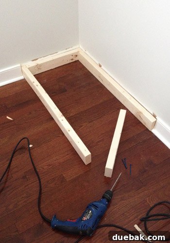 2x4 boards under base of Ikea Dresser