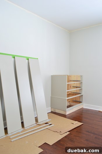 Painted pieces of Ikea Fjell dresser waiting to dry