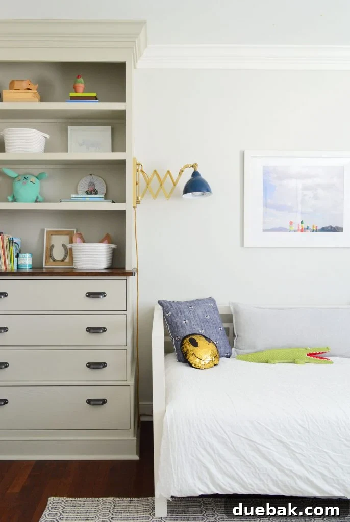 Craft Your Own Library Haven 4 Tall built-in bookshelf extending from floor to ceiling in a child's bedroom, filled with books, toys, and decorative items.