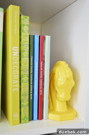 The Family Year in Pictures: How to Build Your Album 2 Stack of Family Yearbook Photo Books on Shelf