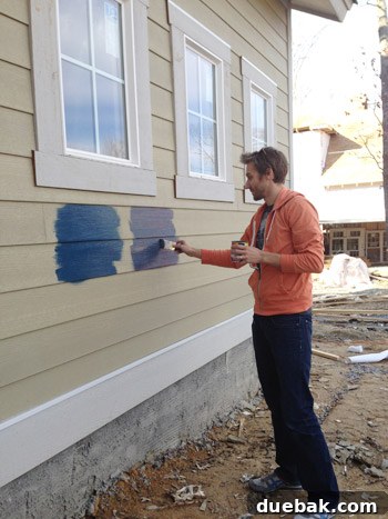 Applying second coat of paint test samples