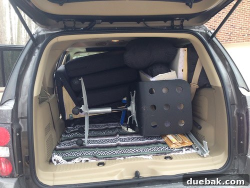 Taming the Runaway Home 9 Buyer loading sectional pieces into her SUV