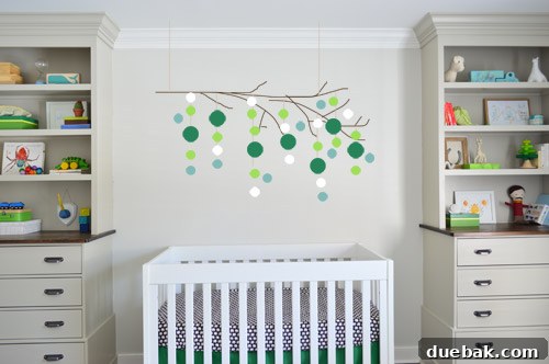 Photoshop mock-up of a colorful nursery mobile made from a manzanita branch with hanging shapes
