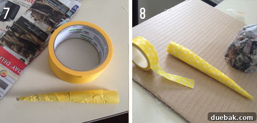 Close-up of the narwhal tusk being shaped with painter's tape and then covered with decorative washi tape