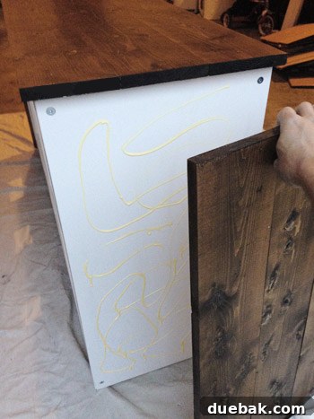 Attaching side wood panels to the Expedit for a waterfall-edge effect.