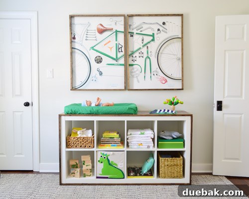 Expedit changing table fully styled with a changing pad and decorative items on shelves.
