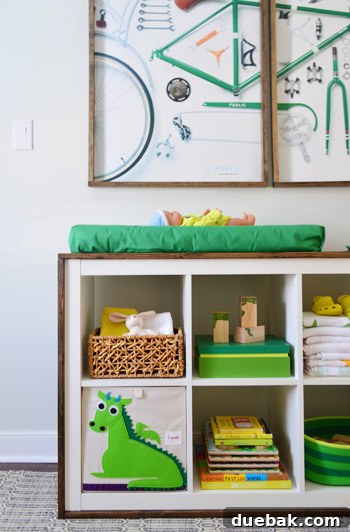 Close-up of the Expedit changing table with storage boxes and decorations.