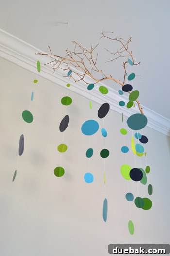 Craft Your Own Adorable Nursery Mobile 13 View of the completed rustic modern baby mobile hanging over the crib